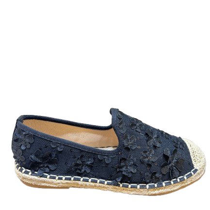 Navy blue espadrille shoe with floral lace design on a white background